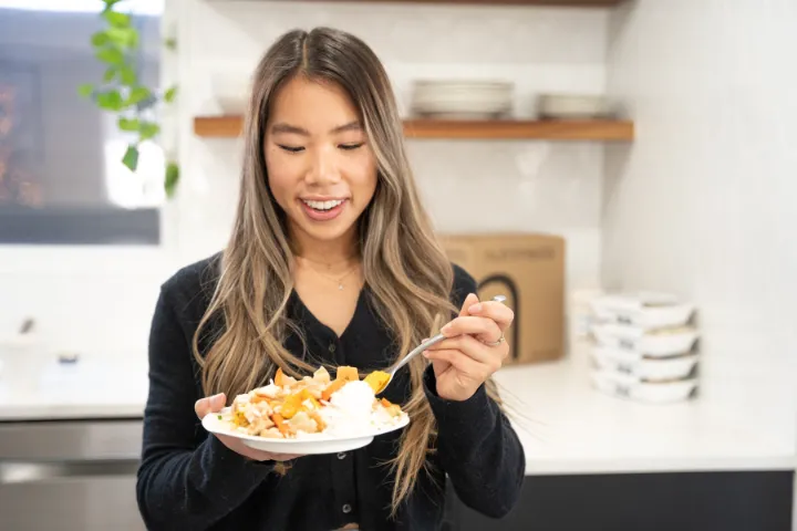 Busy expat in Korea choosing healthy meal prep delivery instead of takeout after work